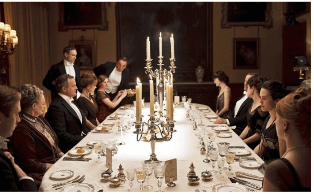 Still of a dinner party scene from the TV show Downton Abbey.